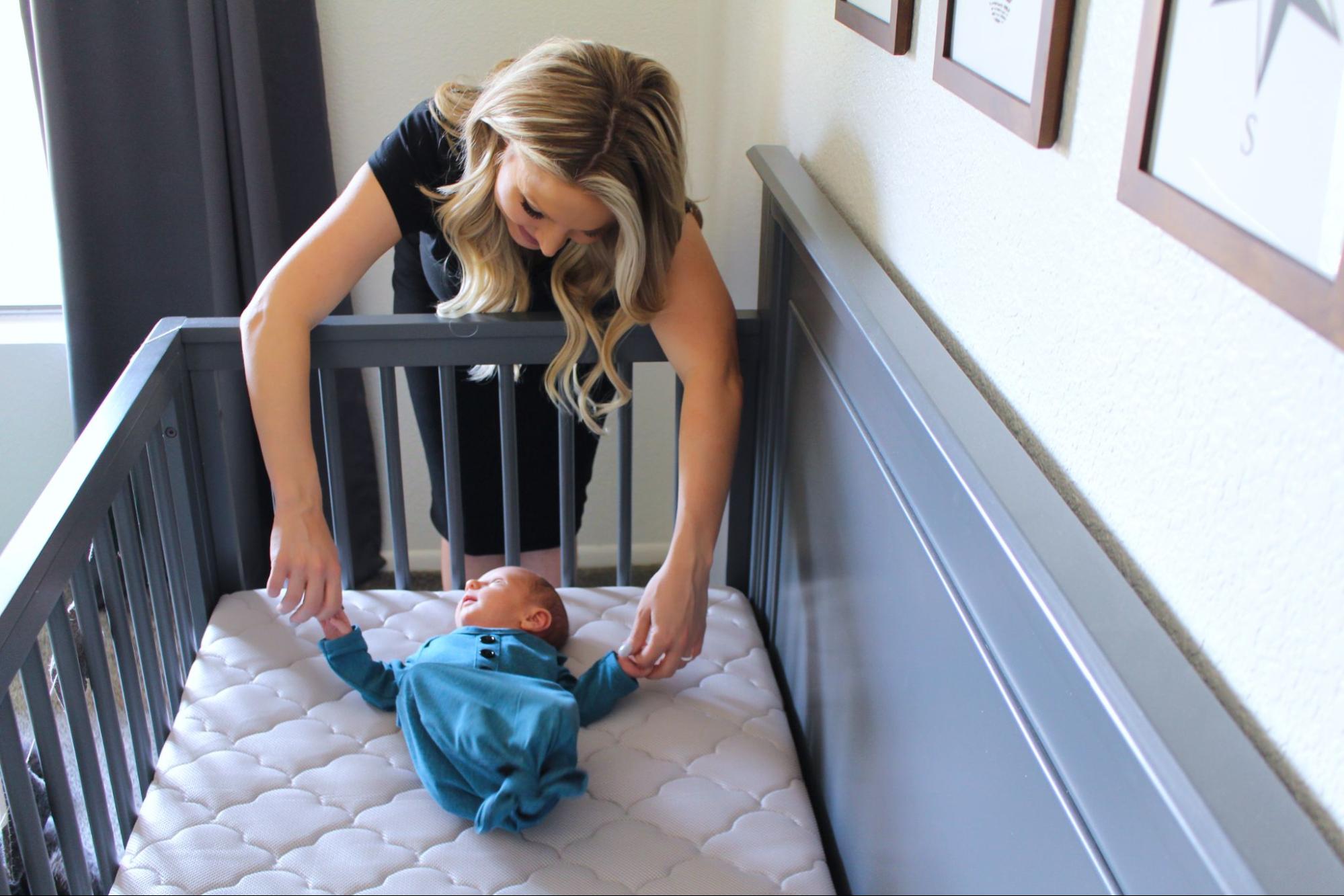 Putting a fashion pillow under baby's mattress