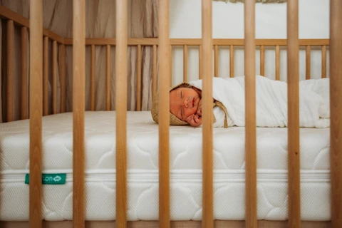 How low should a crib mattress be best sale