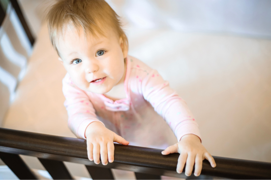 baby in crib wanting to climb out 