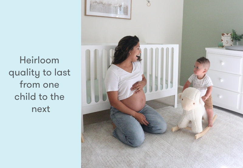 image of a pregnant mom and toddler relaxing in the nursery, sitting next to a newton galileo crib in white color, text reads, "heirloom quality to last from one child to the next"