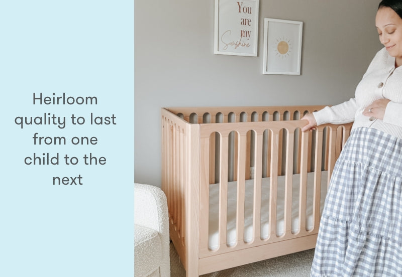 pregnant mom in a nursery standing next to newton galileo crib in natural color, text reads "heirloom quality to last from one child to the next"