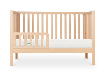 newton galileo crib in natural color converted to toddler mode, with guard, front facing product image with white background.